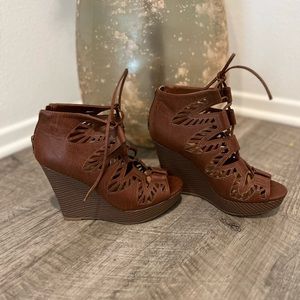 Wedge high heel. Never worn.